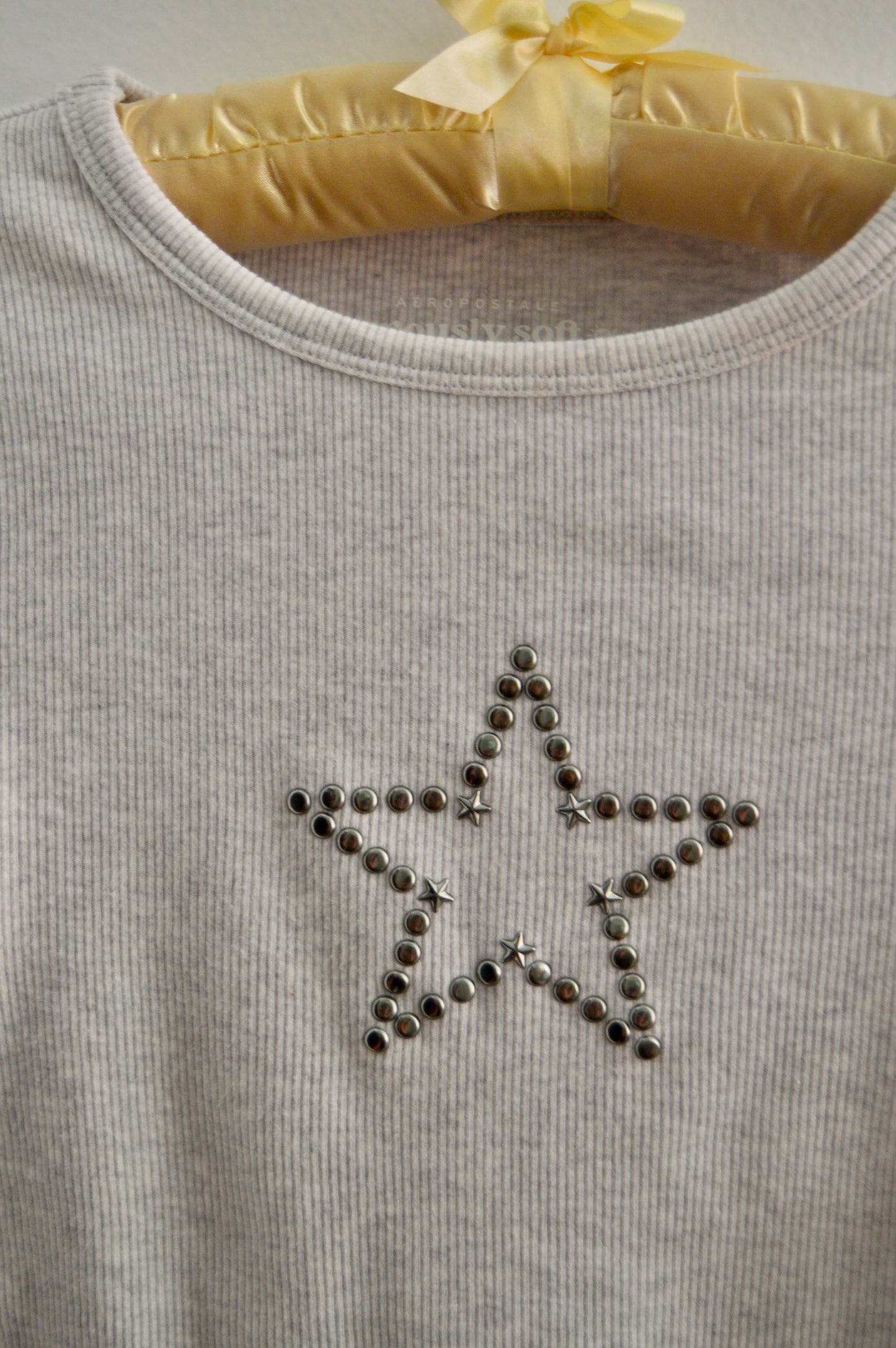Aero studded star baby tee