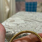 Vintage gold tone twist bangle