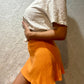Tangerine orange Reformation skirt