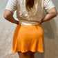 Tangerine orange Reformation skirt