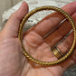 Vintage gold tone twist bangle