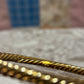 Vintage gold tone twist bangle
